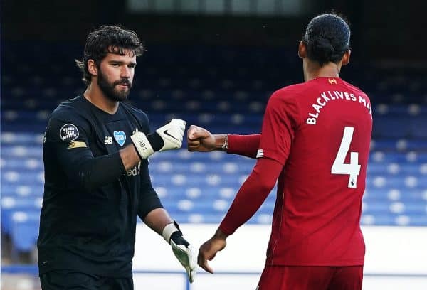 Liverpool goalkeeper Alisson fist bumps Virgil van Dijk during the Premier League match at Goodison Park, Liverpool. (Jon Super/NMC Pool/PA Wire/PA Images)