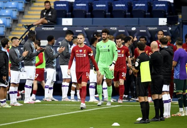 Manchester City form a guard of honour for newly crowned Premier League Champions Liverpool before the Premier League match at the Etihad Stadium, Manchester. PA Photo. Issue date: Thursday July 2, 2020. See PA story SOCCER Man City.{Image: Peter Powell/NMC Pool/PA Wire.)