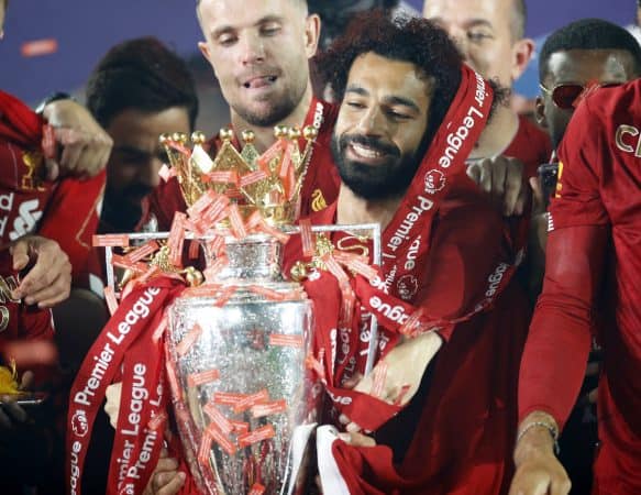 Liverpool's Mohamed Salah celebrates with the Premier League trophy after the Premier League match at Anfield, Liverpool. PA Photo. ( Phil Noble/PA Wire/PA Images)