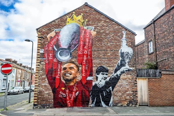 A new mural of Liverpool captain Jordan Henderson lifting the Premier League trophy and former captain Alan Hansen lifting the league trophy by artist Paul Curtis on the gable end of a house on Old Barn Road in Anfield, Liverpool. (Peter Byrne/PA Wire/PA Images)