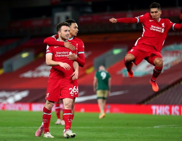 Liverpool's Diogo Jota celebrates scoring his side's second goal of the game with Trent Alexander-Arnold (second right) and Roberto Firmino (right) during the Premier League match at Anfield, Liverpool. (Image: Peter Byrne/PA Wire/PA Images)