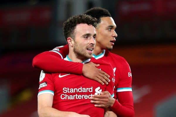 Liverpool's Diogo Jota celebrates scoring his side's second goal of the game with Trent Alexander-Arnold (second right) and Roberto Firmino (right) during the Premier League match at Anfield, Liverpool. (Image: Peter Byrne/PA Wire/PA Images)