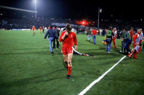Liverpool's Kenny Dalglish walks off the pitch after his team's 1-0 defeat