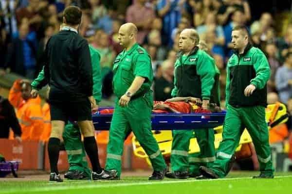 LIVERPOOL, ENGLAND - Tuesday, August 27, 2013: Liverpool's Kolo Toure is stretchered off injured during the Football League Cup 2nd Round match against Notts County at Anfield. (Pic by David Rawcliffe/Propaganda)