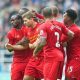 NEWCASTLE-UPON-TYNE, ENGLAND - Saturday, October 19, 2013: Liverpool's captain Steven Gerrard is mobbed by team-mates after scoring the first equalising goal against Newcastle United during the Premiership match at St. James' Park. (Pic by David Rawcliffe/Propaganda)