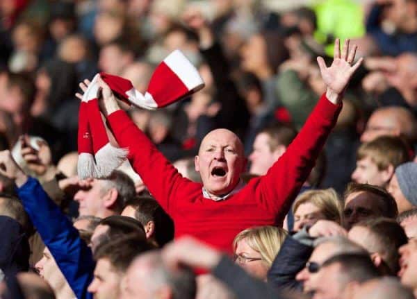 CARDIFF, WALES - Saturday, March 22, 2014: A Liverpool supporter celebrates his side's 6-3 victory over Cardiff City during the Premiership match at the Cardiff City Stadium. (Pic by David Rawcliffe/Propaganda)