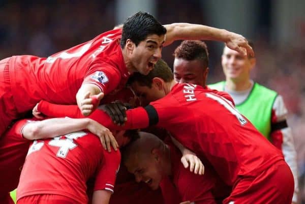 LIVERPOOL, ENGLAND - Sunday, April 13, 2014: Liverpool's Philippe Coutinho Correia celebrates scoring the third goal against Manchester City with team-mate Luis Suarez during the Premiership match at Anfield. (Pic by David Rawcliffe/Propaganda)