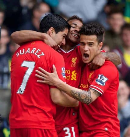 NORWICH, ENGLAND - Sunday, April 20, 2014: Liverpool's Luis Suarez celebrates scoring the second goal against Norwich City with team-mates Raheem Sterling and Philippe Coutinho Correia during the Premiership match at Carrow Road. (Pic by David Rawcliffe/Propaganda)