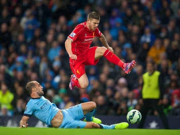 MANCHESTER, ENGLAND - Monday, August 25, 2014: Liverpool's Javier Manquillo in action against Manchester City's Pablo Zabaleta during the Premier League match at the City of Manchester Stadium. (Pic by David Rawcliffe/Propaganda)