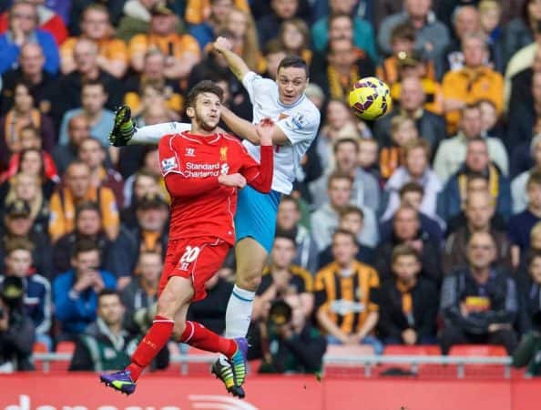 LIVERPOOL, ENGLAND - Saturday, October 25, 2014: Liverpool's Adam Lallana in action against Hull City's James Chester during the Premier League match at Anfield. (Pic by David Rawcliffe/Propaganda)