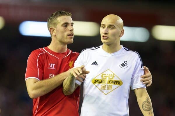 LIVERPOOL, ENGLAND - Tuesday, October 28, 2014: Swansea City's Jonjo Shelvey is restrained by Liverpool's Jordan Henderson at the final whistle during the Football League Cup 4th Round match at Anfield. (Pic by David Rawcliffe/Propaganda)