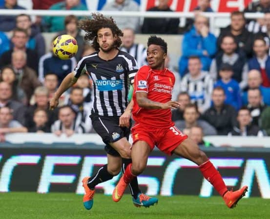 NEWCASTLE-UPON-TYNE, ENGLAND - Saturday, November 1, 2014: Liverpool's Raheem Sterling in action against Newcastle United's captain Fabricio Coloccini during the Premier League match at St. James' Park. (Pic by David Rawcliffe/Propaganda)