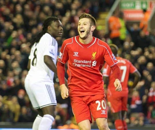 LIVERPOOL, ENGLAND - Monday, December 29, 2014: Liverpool's Adam Lallana celebrates his side's fourth goal against Swansea City during the Premier League match at Anfield. (Pic by David Rawcliffe/Propaganda)