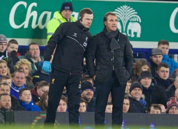 LIVERPOOL, ENGLAND - Friday, February 6, 2015: Liverpool's physiotherapist Chris Morgan gives manager Brendan Rodgers an update after Daniel Sturridge leaves the substitute bench down the tunnel against Everton during the Premier League match at Goodison Park, the 224th Merseyside Derby. (Pic by David Rawcliffe/Propaganda)