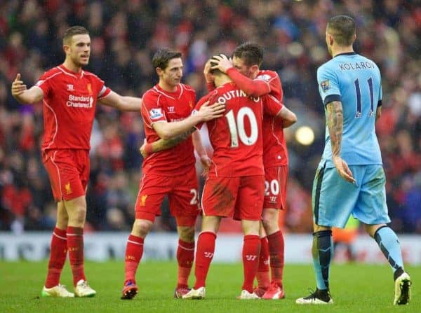 LIVERPOOL, ENGLAND - Sunday, March 1, 2015: Liverpool's goal scorer Philippe Coutinho Correia celebrates with team-mates captain Jordan Henderson, Joe Allen and Adam Lallana after their side's 2-1 victory over Manchester City during the Premier League match at Anfield. (Pic by David Rawcliffe/Propaganda)