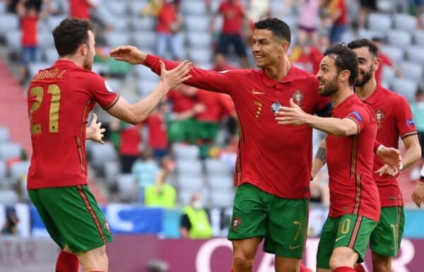 MUNICH, GERMANY - JUNE 19: Cristiano Ronaldo of Portugal celebrates with Diogo Jota and Bernardo Silva after scoring their side's first goal during the UEFA Euro 2020 Championship Group F match between Portugal and Germany at Football Arena Munich on June 19, 2021 in Munich, Germany. (Photo by Sebastian Widmann - UEFA/UEFA via Getty Images)