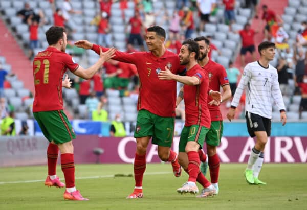 MUNICH, GERMANY - JUNE 19: Cristiano Ronaldo of Portugal celebrates with Diogo Jota and Bernardo Silva after scoring their side's first goal during the UEFA Euro 2020 Championship Group F match between Portugal and Germany at Football Arena Munich on June 19, 2021 in Munich, Germany. (Photo by Sebastian Widmann - UEFA/UEFA via Getty Images)