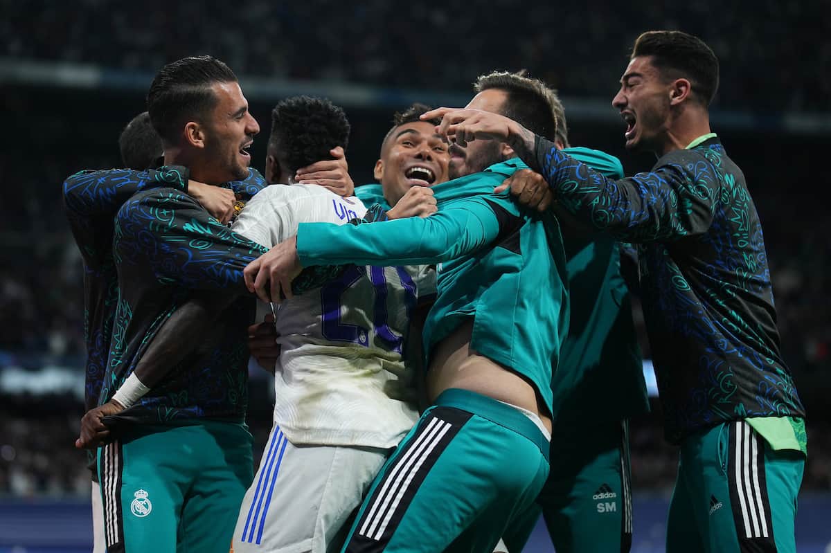 MADRID, SPAIN - MAY 04: Vinicius Junior of Real Madrid celebrates with team mates after Rodrygo of Real Madrid (not pictured) scores their sides second goal during the UEFA Champions League Semi Final Leg Two match between Real Madrid and Manchester City at Estadio Santiago Bernabeu on May 04, 2022 in Madrid, Spain. (UEFA)