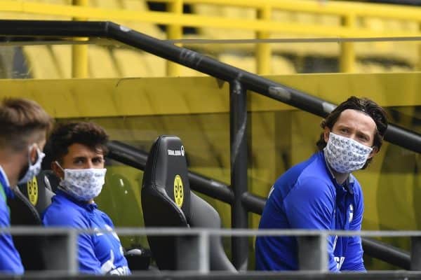 Schalke substitute players sit on the bench during the German Bundesliga soccer match between Borussia Dortmund and Schalke 04 in Dortmund (Martin Meissner)