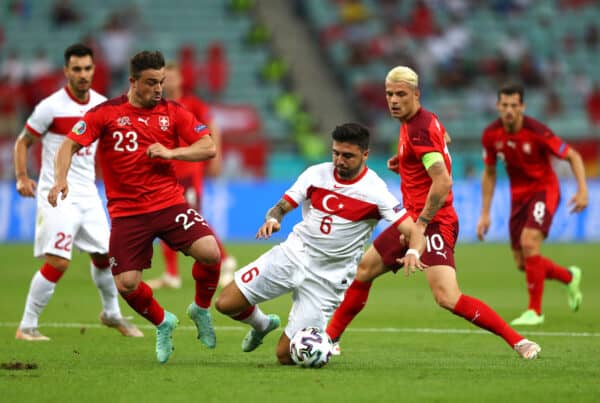 BAKU, AZERBAIJAN - JUNE 20: Ozan Tufan of Turkey is challenged by Xherdan Shaqiri of Switzerland during the UEFA Euro 2020 Championship Group A match between Switzerland and Turkey at Baku Olimpiya Stadionu on June 20, 2021 in Baku, Azerbaijan. (Photo by Matthew Lewis - UEFA/UEFA via Getty Images)