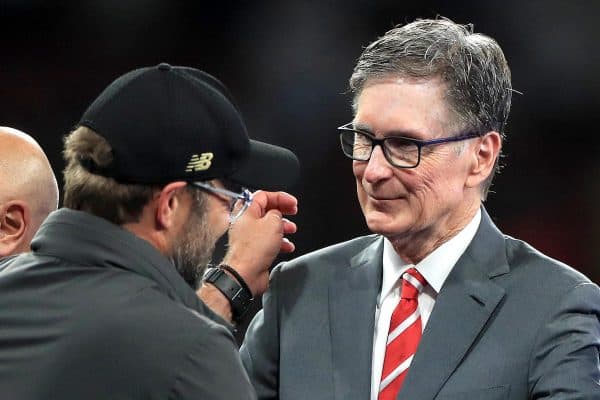 Jurgen Klopp (left) shakes hands with club owner John W. Henry (Mike Egerton / PA Images)