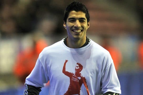 Liverpool's Luis Suarez warms up before the match with Wigan at The DW Stadium