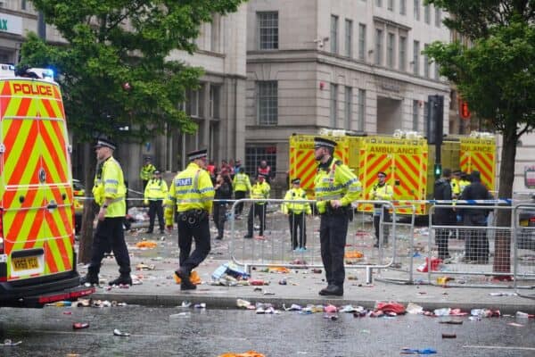 Police and emergency personnel at the cordon (Owen Humphreys/PA)