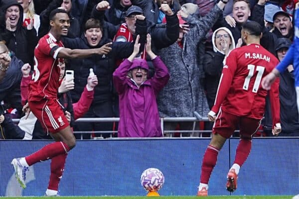 Liverpool's Ryan Gravenberch (left) celebrates scoring their side's first goal of the game with team-mate Mohamed Salah as Everton's James Garner (right) looks frustrated during the Premier League match at Anfield, Liverpool. Picture date: Saturday September 20, 2025.