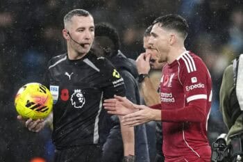 Liverpool defender Andrew Robertson, controversially ruled offside as a Virgil van Dijk equaliser was disallowed, talks to referee Chris Kavanagh (Nick Potts/PA) embedded282351343