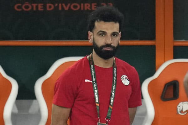 Egypt's injured player Mohamed Salah watches his team mates warm up before the African Cup of Nations Group B soccer match between Cape Verde and Egypt at the Felix Houphouet Boigny stadium in Abidjan, Ivory Coast, Monday, Jan. 22, 2024. (AP Photo/Themba Hadebe)