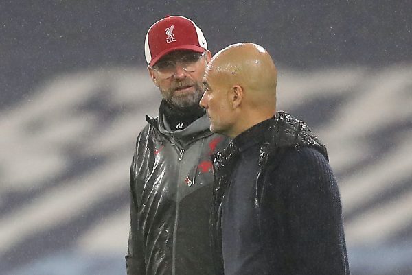 Liverpool manager Jurgen Klopp (left) and Manchester City manager Pep Guardiola in discussion during the Premier League match at the Etihad Stadium, Manchester. PA Photo. Picture date: Sunday November 8, 2020. See PA story SOCCER Man City. Photo credit should read: Martin Rickett/PA Wire. RESTRICTIONS: EDITORIAL USE ONLY No use with unauthorised audio, video, data, fixture lists, club/league logos or "live" services. Online in-match use limited to 120 images, no video emulation. No use in betting, games or single club/league/player publications.