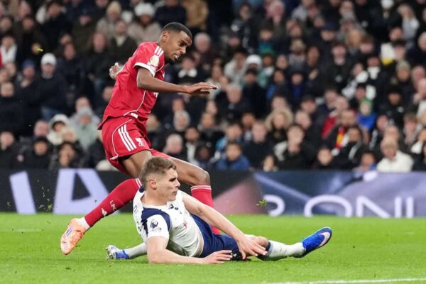 Liverpool’s Alexander Isak is tackled by Tottenham's Micky van der Ven