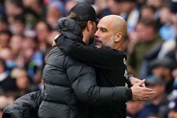 Liverpool manager Jurgen Klopp (left) and Manchester City manager Pep Guardiola embrace at full-time after the Premier League match at the Etihad Stadium, Manchester. Picture date: Sunday April 10, 2022.