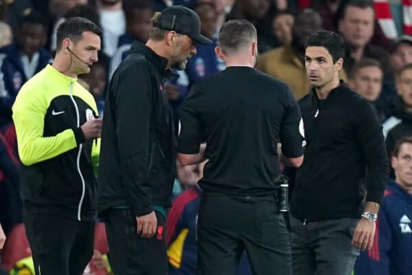 Match referee Michael Oliver (centre) speaks to Liverpool manager Jurgen Klopp and Arsenal manager Mikel Arteta during the Premier League match at the Emirates Stadium, London. Picture date: Sunday October 9, 2022.