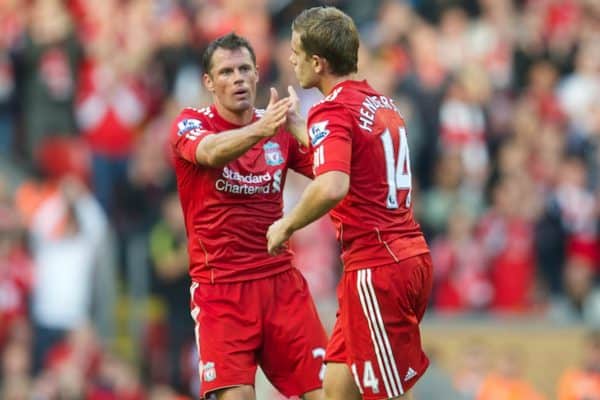 LIVERPOOL, ENGLAND - Saturday, August 27, 2011: Liverpool's Jordan Henderson is congratulated by team-mate Jamie Carragher as he is substituted against Bolton Wanderers during the Premiership match at Anfield. (Pic by David Rawcliffe/Propaganda)